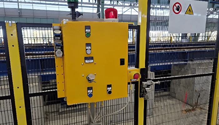 mGard mechanical trapped keys mounted on a yellow control box at the Duferco site, demonstrating compliance with interlocking device standards.