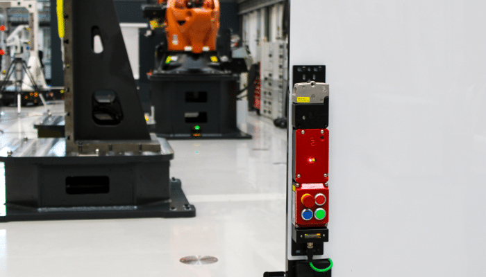 Red amGardpro safety solution featuring a Power over Ethernet guard lock and control pods, highlighting advanced safety technology.