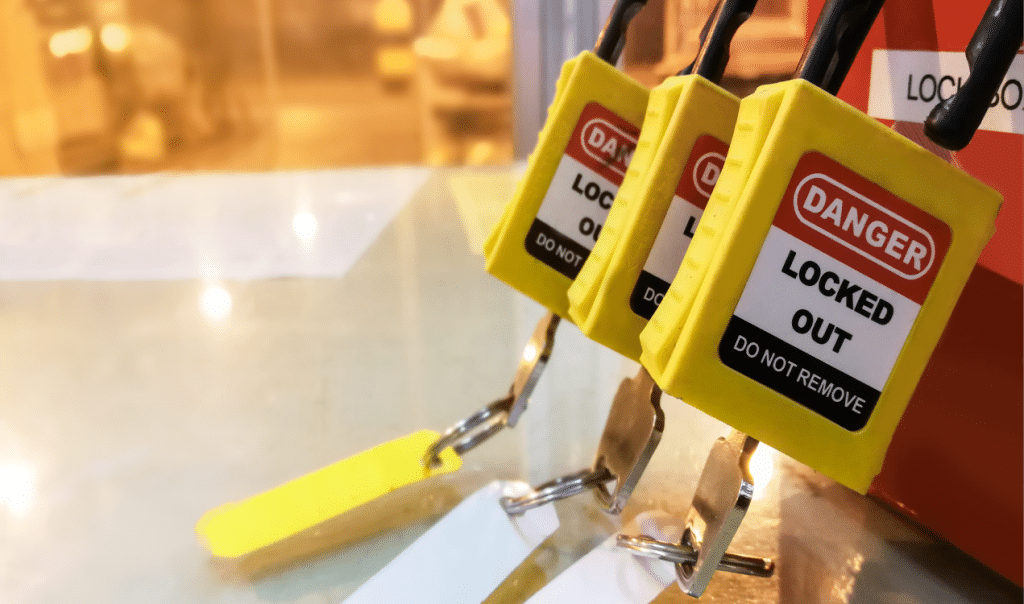 Lockout/Tagout (LOTO) system with yellow locks and red safety box