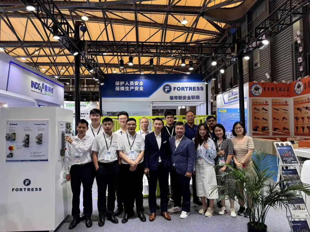 Fortress China team at a trade show booth engaging with attendees.